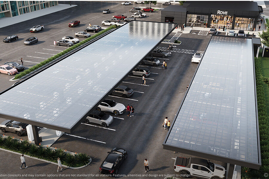 Concept rendering for Rove full-service charging center with dozens of EV charging stations under solar canopies, plus a car wash and small market.